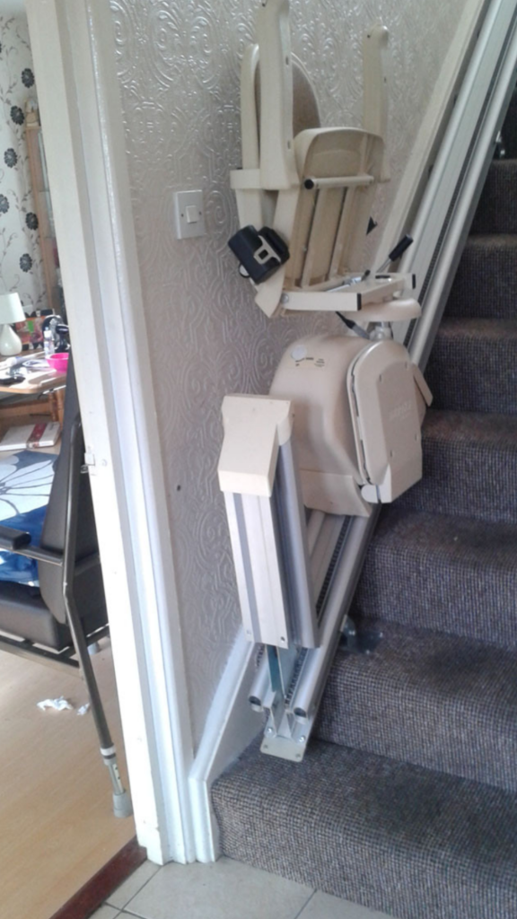 Brooks-Acorn-Straight-Stairlift-Chairlift folded with hinged rail raised