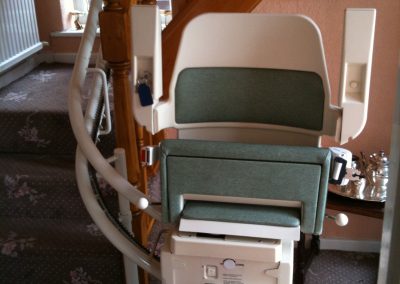 Halton Sapphire Curved Stairlift with Green Upholstery