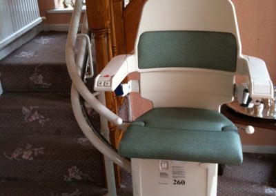 Stannah Sarum Curved Stairlift with Green Upholstery