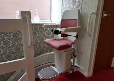 Halton-Sapphire-Curved-Stairlift-Curve-Chairlift in Red Upholstery Swivel Seat