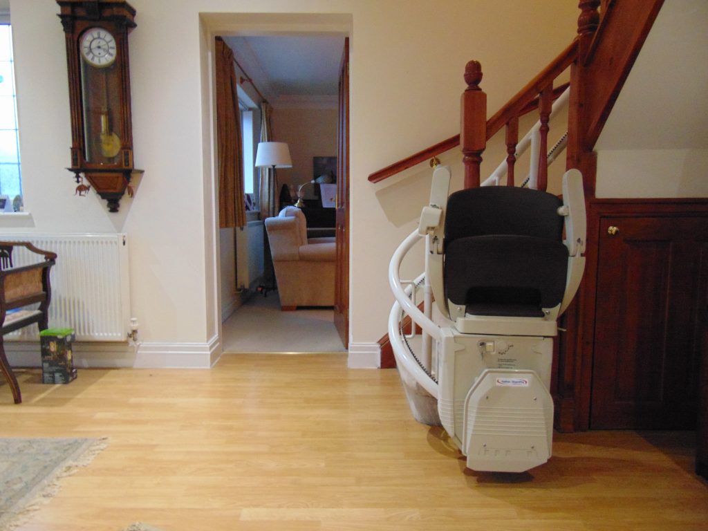 Reconditioned Halton Signature Curved Stair Lift with black seat
