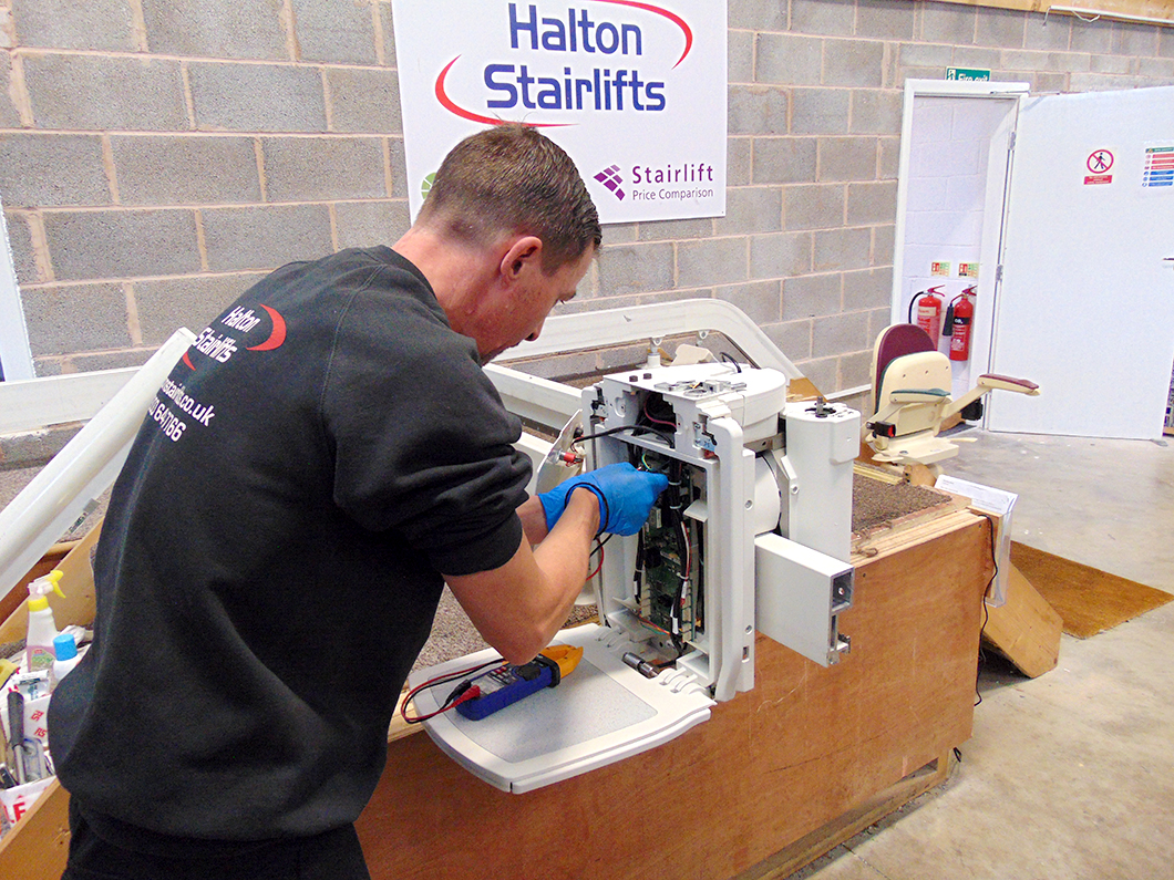 engineer preparing the Halton T565 curved stairlift
