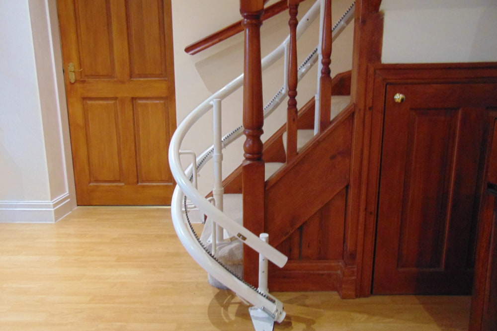 white stairlift rail to help people descent stairs after injury